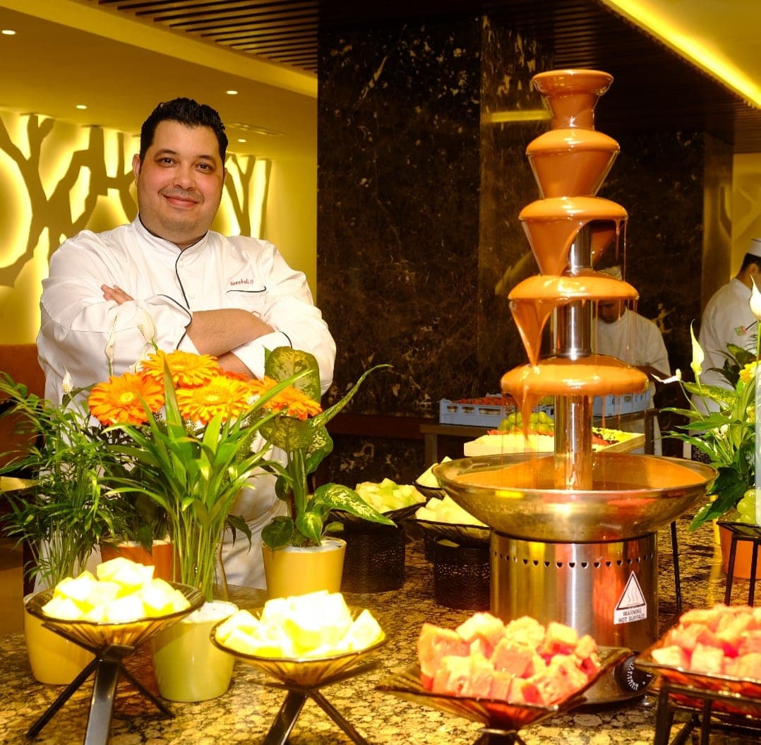 Chef Tarik preparing desserts table